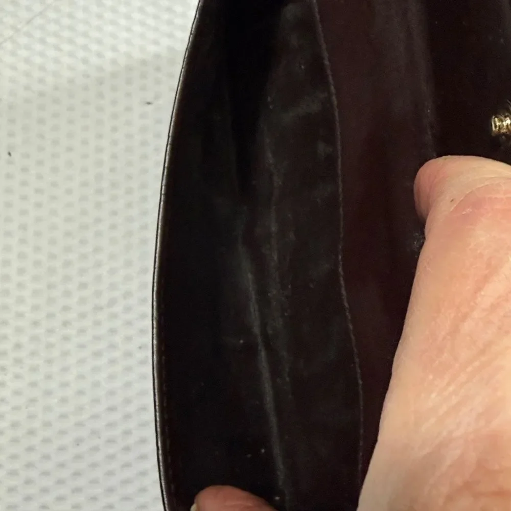 Gucci Dark Brown Embossed Clutch wallet inside is clean. GUC much life left!